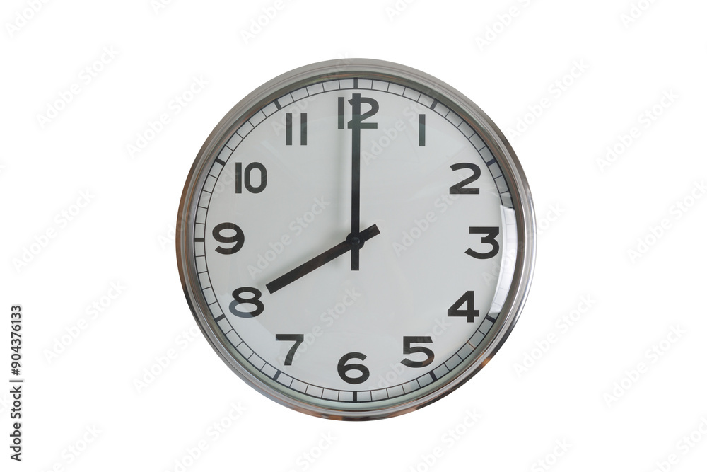 A white round shape wall clock with black hands showing the time of 8 o'clock cutout from background. Short hand at 8 o'clock and long hand at number 12. A white round shape wall clock with black hands showing the time of 8 o'clock cutout from background. Short hand at 8 o'clock and long hand at number 12.