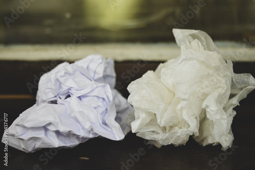 white crumpled paper ball with specular