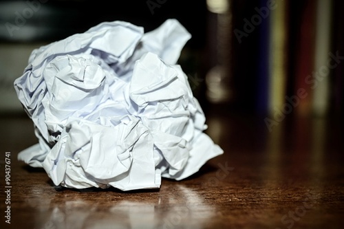 white crumpled paper ball with specular