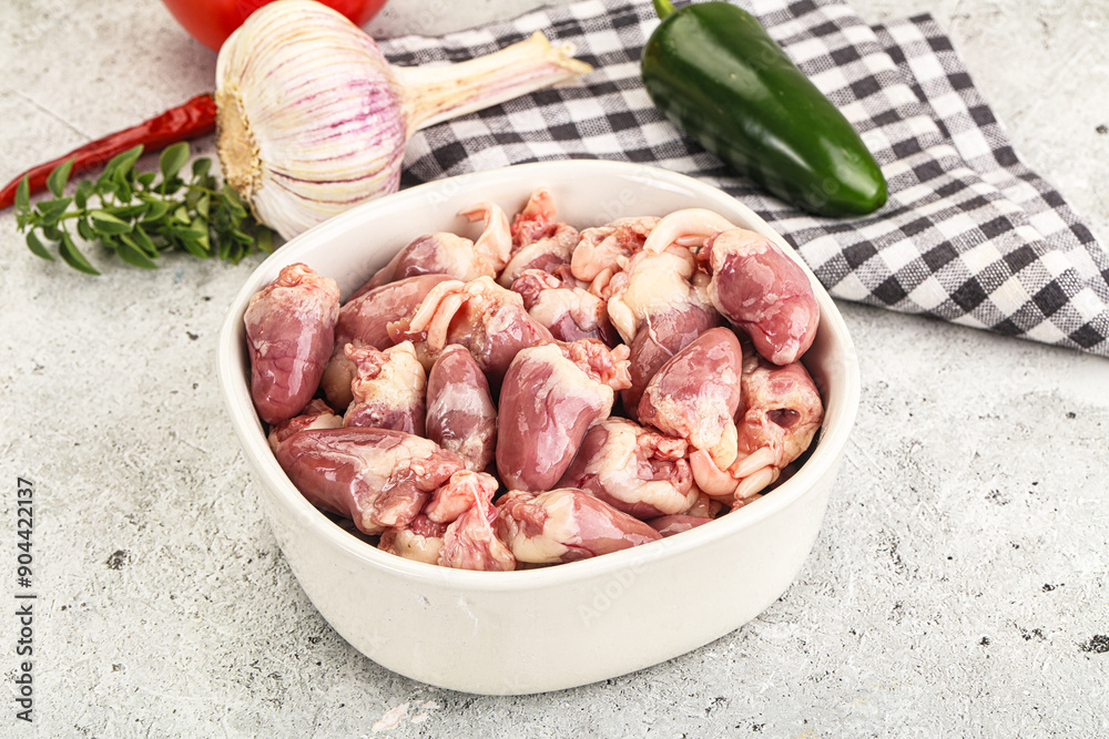 Fresh raw chicken hearts in the bowl Fresh raw chicken hearts in the bowl
