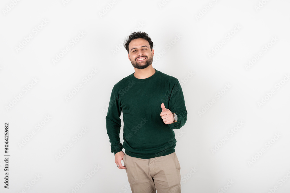 Man looking at camera smiling with thumb up Man looking at camera smiling with thumb up