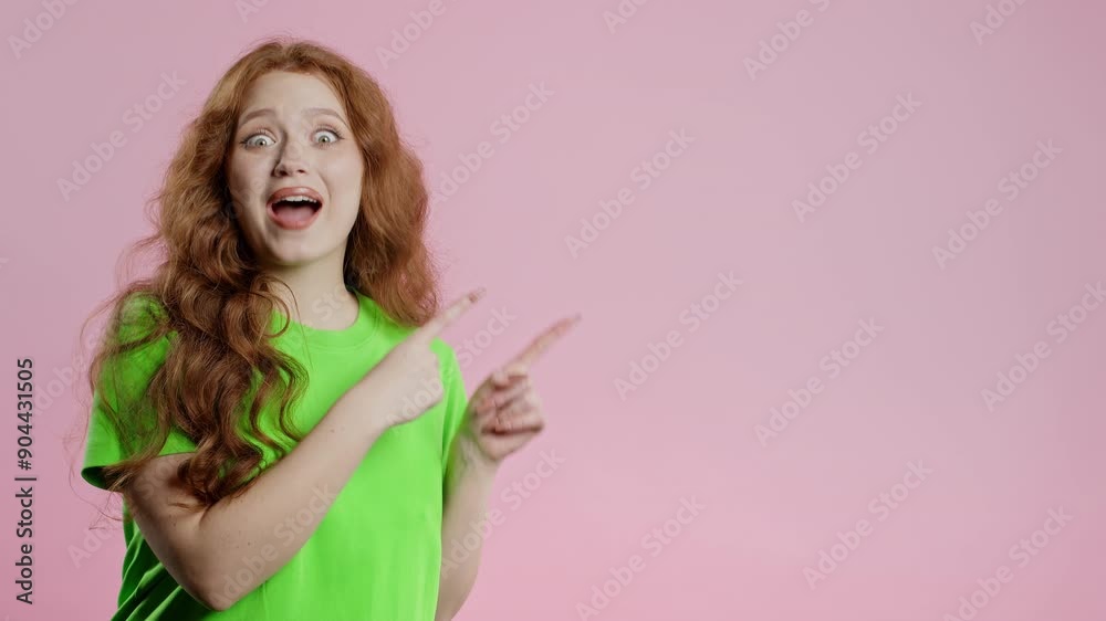 Smiling young lady looking to empty place for your advertising. Recommending woman pointing at right side, copy space. Female presenting something isolated on pink background. Smiling young lady looking to empty place for your advertising. Recommending woman pointing at right side, copy space. Female presenting something isolated on pink background.