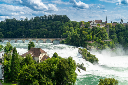 Rhine Falls (Rheinfall) in Switzerland, with castle Schloss Laufen, Neuhausen near the Canton Schaffhausen in Europe photo