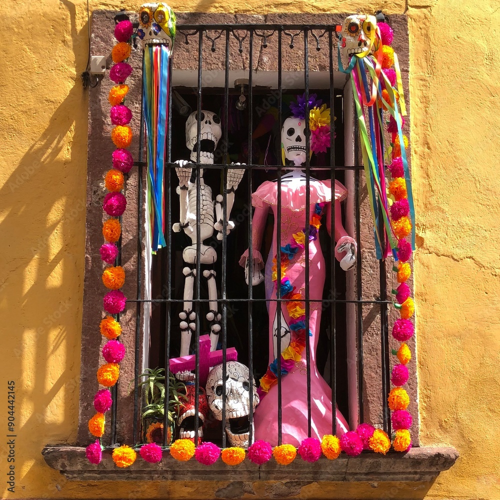 Fototapeta premium Window decorated with flowers and skeletons for Day of the Dead in San Miguel de Allende, Mexico