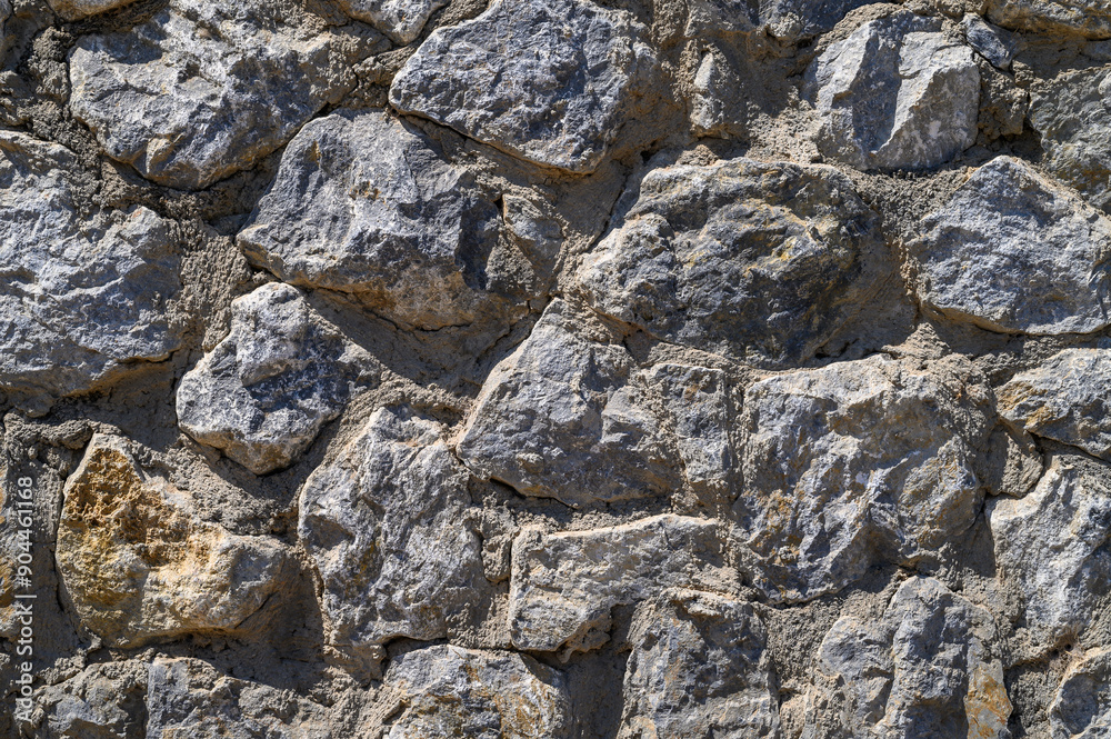 fence real stone wall surface with cement as background. fence real stone wall surface with cement as background.