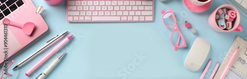 Pink Desk Setup With Laptop, Keyboard, Pens, and Accessories on Blue Background