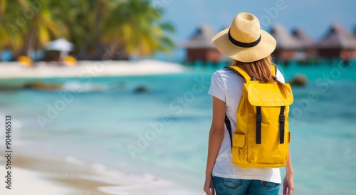 Young Woman With Yellow Backpack at Tropical Beach Resort on a Sunny Day