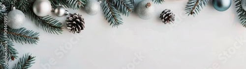 Snowy Pine Cones and Evergreen Branches on a White Background