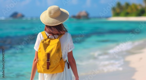 Woman in Yellow Backpack Stands by Tropical Beach With Clear Blue Water and I...