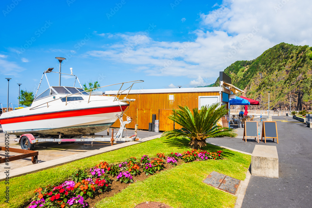 Fototapeta premium Restaurant in Povoacao port with boats, Sao Miguel island, Azores, Portugal