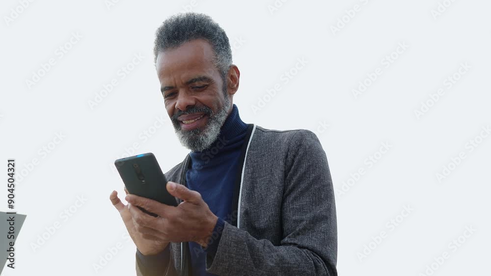 Happy senior multiracial woman using smartphone device outside. Old Brazilian male sending online message on cellphone app. Technology and elderly lifestyle concept. Happy senior multiracial woman using smartphone device outside. Old Brazilian male sending online message on cellphone app. Technology and elderly lifestyle concept.