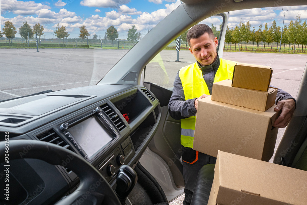 Man delivery service contractor. Courier takes boxes out of car. Delivery specialist delivers packages to recipients. Contractor takes cardboard boxes from minivan. Delivery specialist man Man delivery service contractor. Courier takes boxes out of car. Delivery specialist delivers packages to recipients. Contractor takes cardboard boxes from minivan. Delivery specialist man