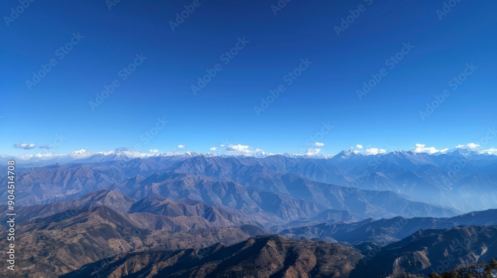 Scenic view of mountains with a clear blue sky above Scenic view of mountains with a clear blue sky above