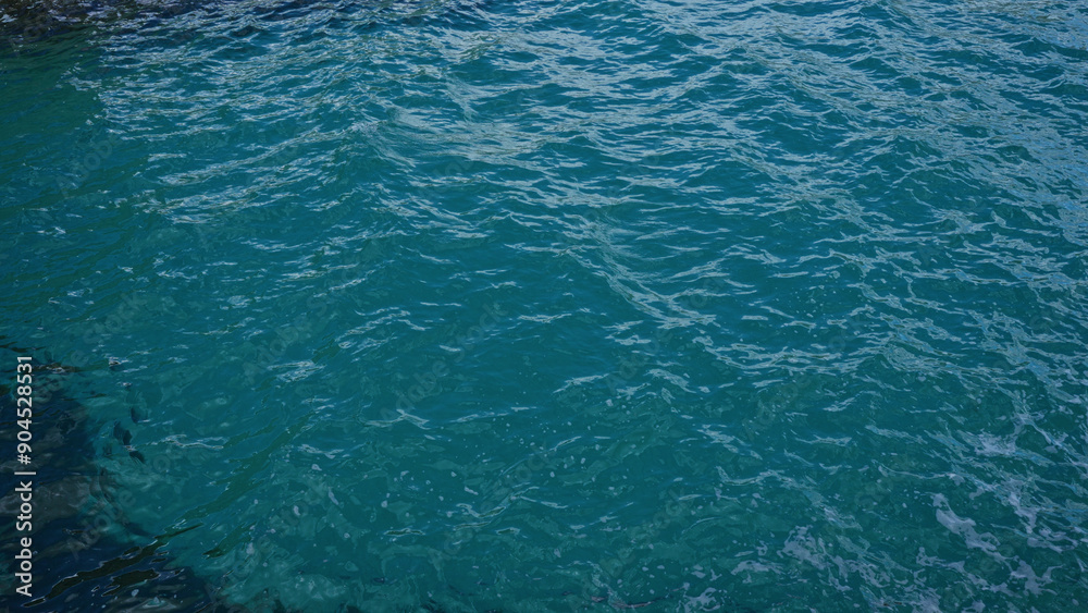 Crystal clear blue sea waters ripple gently in torre dell'orso, salento, puglia, italy, showcasing the serene and idyllic beauty of the european coastal landscape. Crystal clear blue sea waters ripple gently in torre dell'orso, salento, puglia, italy, showcasing the serene and idyllic beauty of the european coastal landscape.