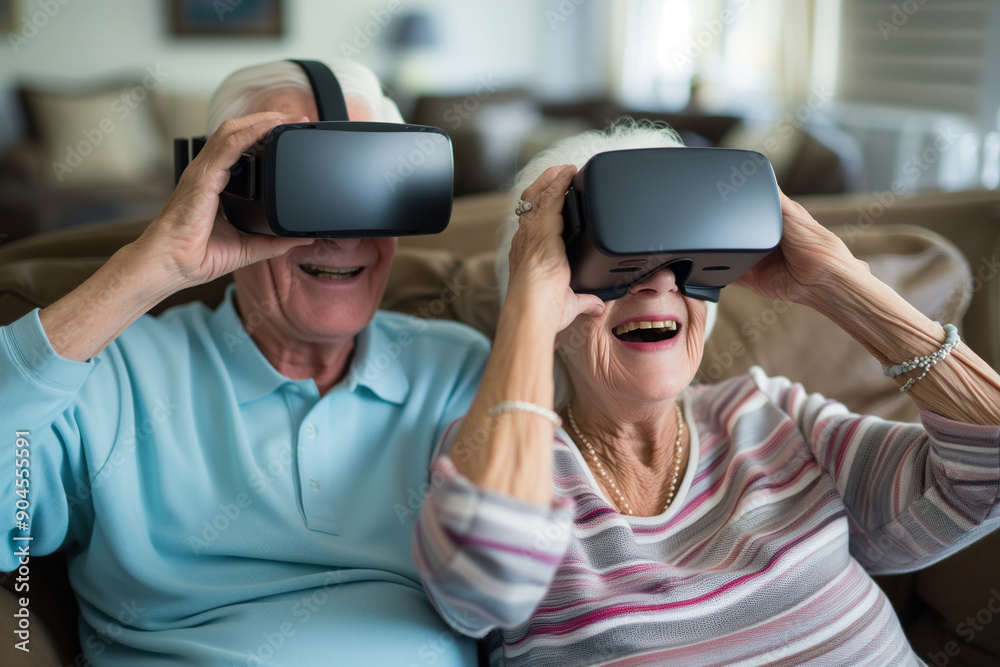 A man and a woman are sitting on a couch wearing virtual reality headsets A man and a woman are sitting on a couch wearing virtual reality headsets