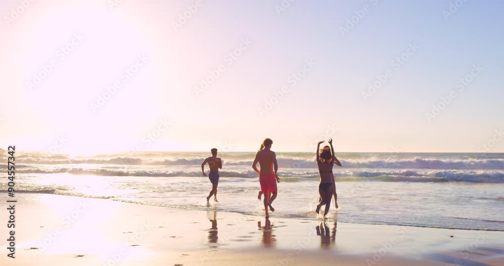 Friends, running and beach for swimming in ocean, outdoor and bonding together with freedom on vacation. Women, men and diversity in travel adventure for wellness, sea and happy on holiday in sunset Friends, running and beach for swimming in ocean, outdoor and bonding together with freedom on vacation. Women, men and diversity in travel adventure for wellness, sea and happy on holiday in sunset