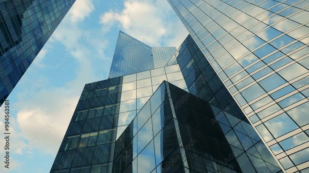 Glass skyscrapers in urban cityscape reflect sky, creating futuristic corporate setting