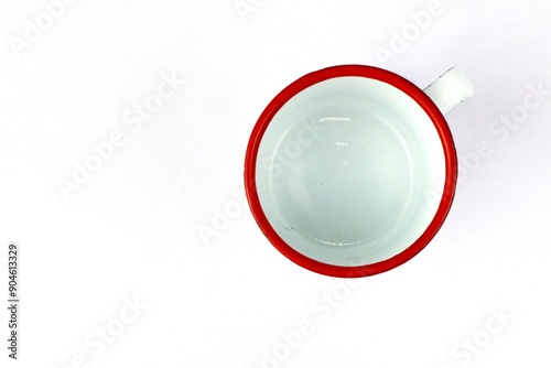 White enamel glass with floral pattern on isolated white background photo