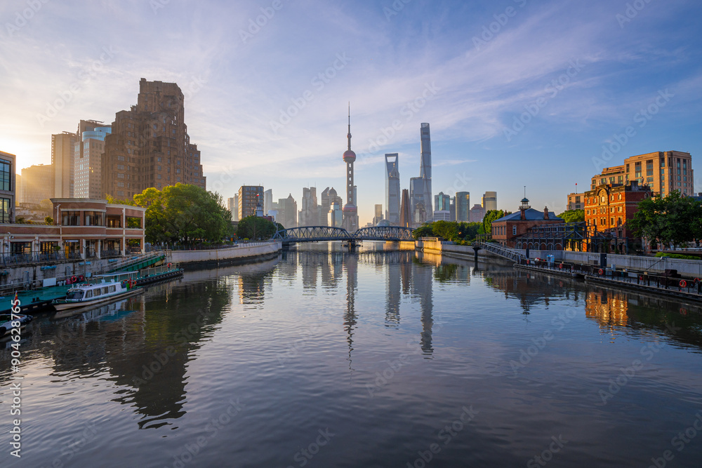 Naklejka premium view of shanghai skyline and bridge at sunrise