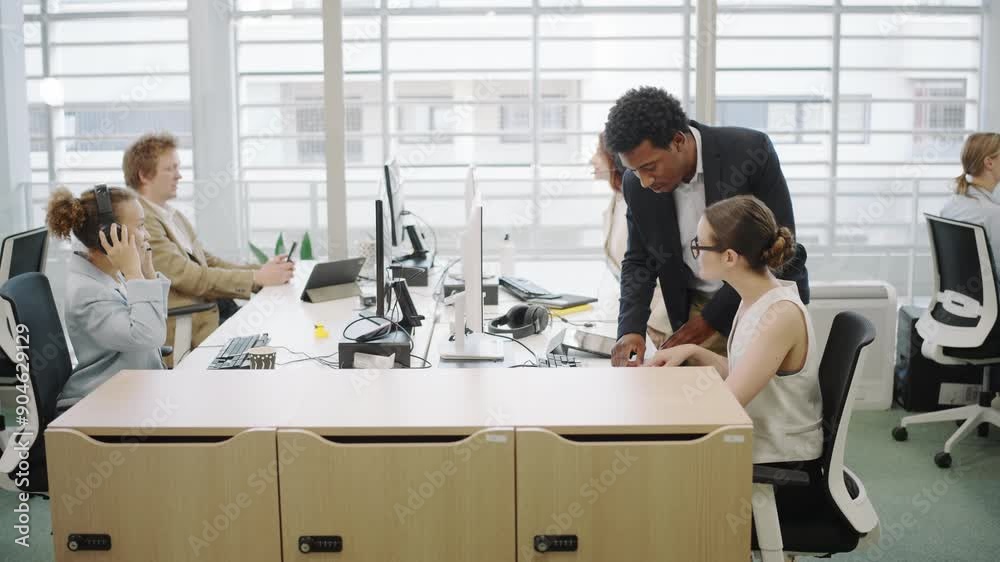 In a modern office setting, employees utilize computers to team up and collaborate in meetings, highlighting the importance of teamwork and technology in promoting workplace collaboration In a modern office setting, employees utilize computers to team up and collaborate in meetings, highlighting the importance of teamwork and technology in promoting workplace collaboration