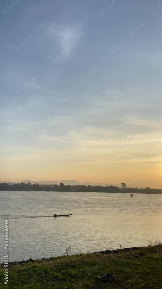 Mekong River Dawn: Fishing Boats and Scenic Mountains Mekong River Dawn: Fishing Boats and Scenic Mountains