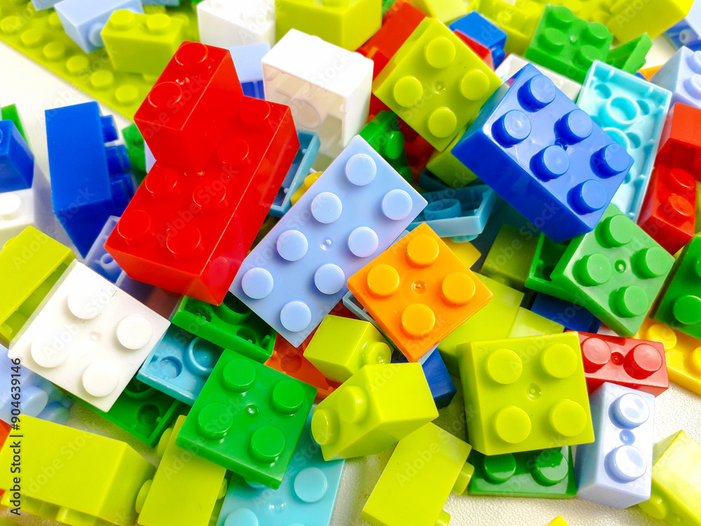 Naklejka premium Various colored toy blocks on a white background. Educational toys for children