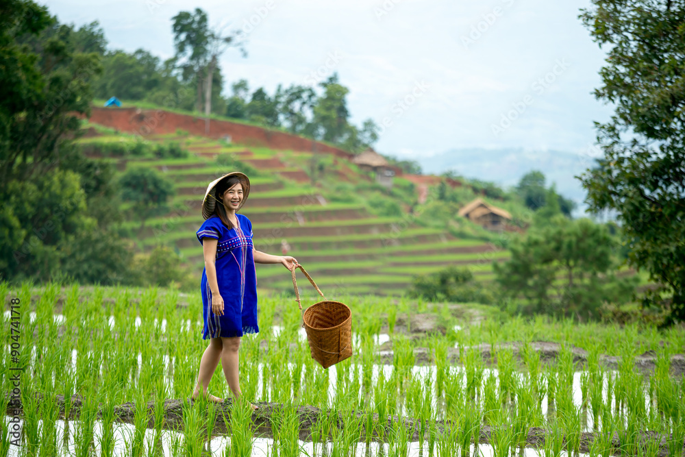 custom made wallpaper toronto digitalWoman in blue traditional hmong dress and straw hat smiling with basket in terraced rice field with green hills and village in background