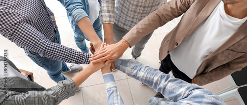 Group of people putting han...