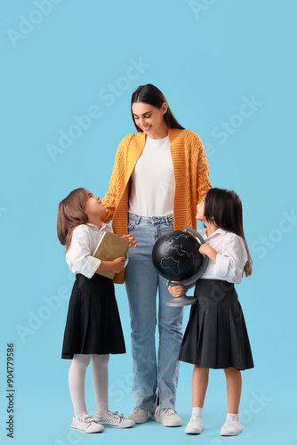 Little school girls with fe...