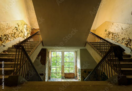 lost place stairway flooded with light