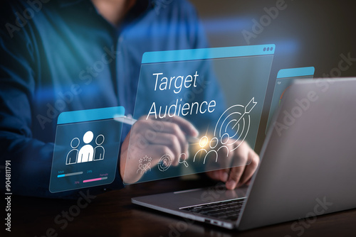 Target Audience concept , target marketing , man using laptop to analyze data  to find a target people group.