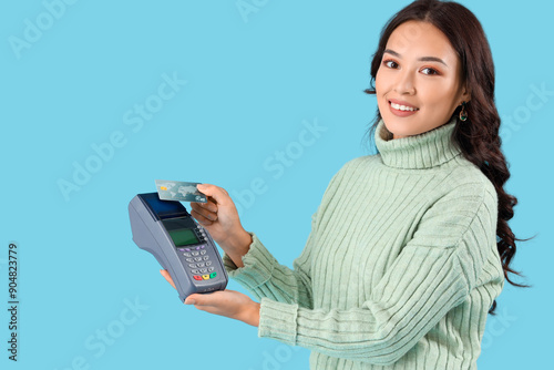 Young Asian woman with paym...