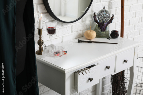 Halloween decor on dressing table in room photo