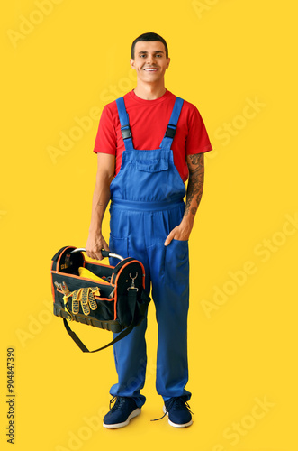 Male car mechanic with tool...