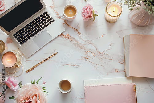 Flat lay laptop, a cup of coffee, notebook and a vase of flowers sit on a table. Concept of relaxation and productivity #904868131