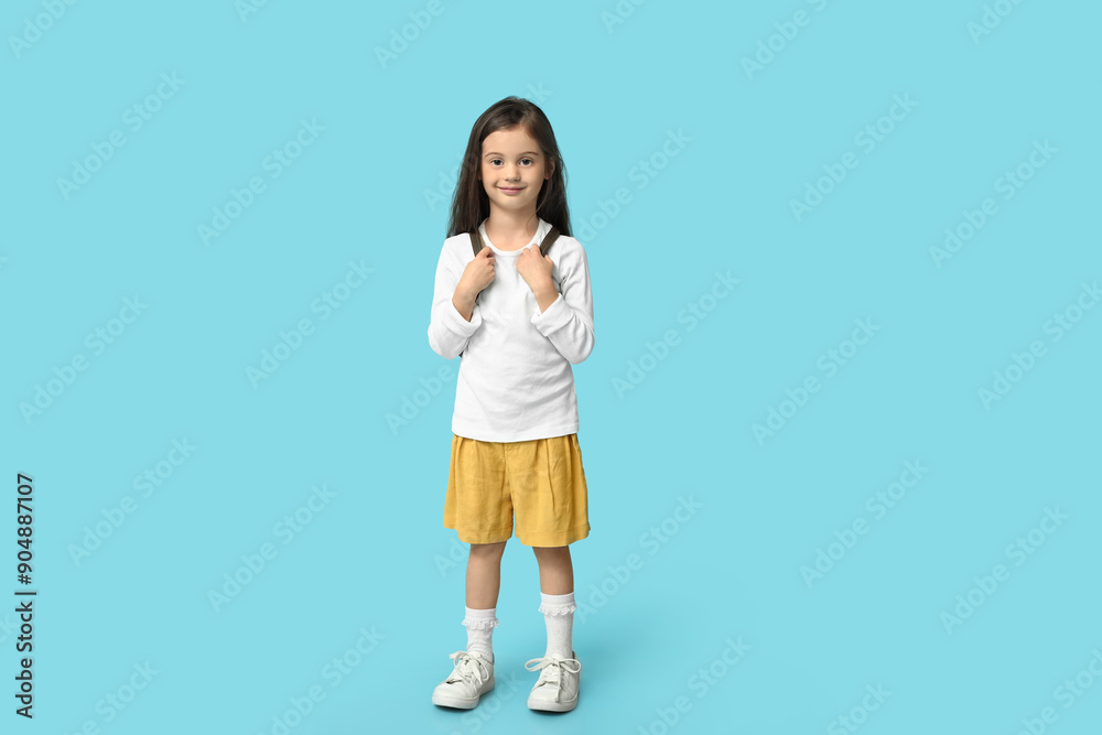 Cute little girl in stylish clothes on blue background Cute little girl in stylish clothes on blue background