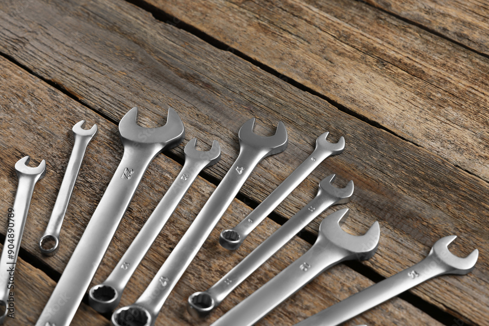 Many auto mechanic's tools on wooden table Many auto mechanic's tools on wooden table