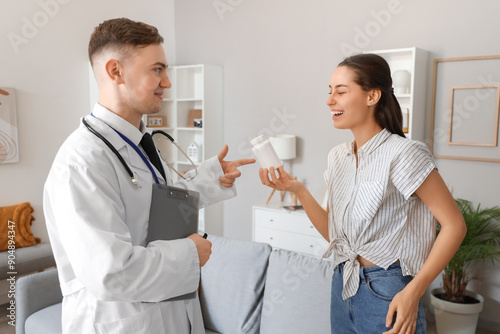 Male doctor prescribing ill...