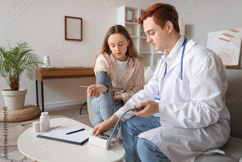 Male doctor measuring blood...