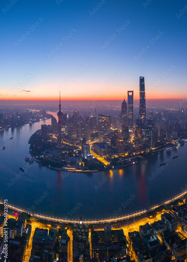 Obraz premium Aerial view of modern city skyline and buildings at sunrise in Shanghai.