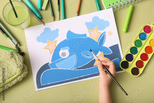 Child's hand painting blue ...