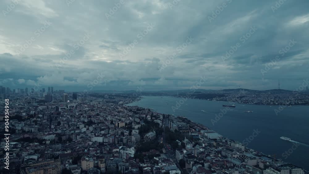 Epic blue hour of the Istanbul cityscape and the river with boats, cloudy sky, copy space and slow motion Epic blue hour of the Istanbul cityscape and the river with boats, cloudy sky, copy space and slow motion
