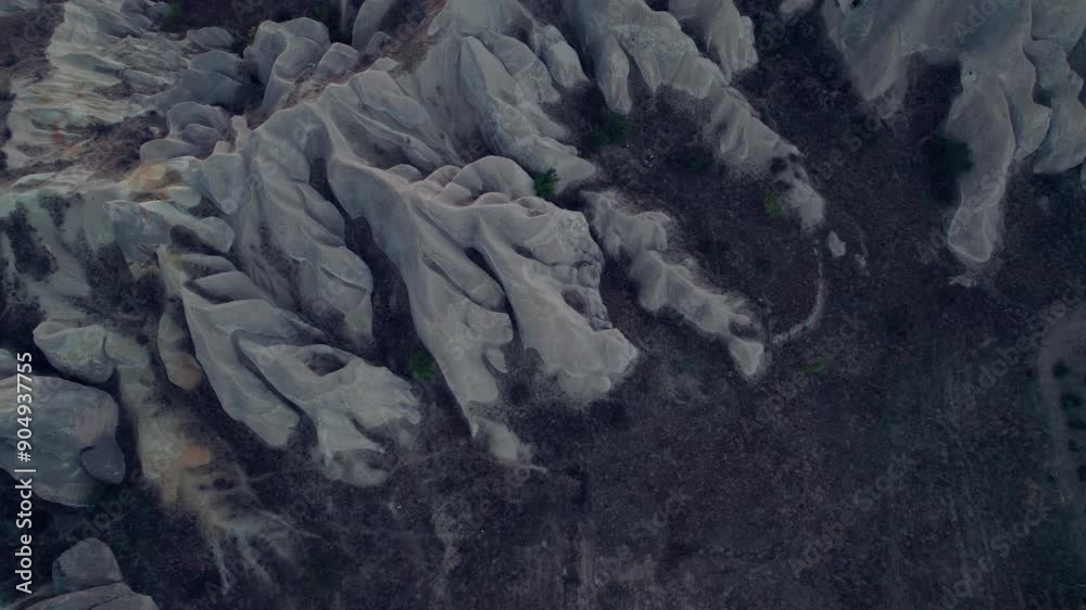 Aerial view of tourists atop unique rock formations in Cappadocia Aerial view of tourists atop unique rock formations in Cappadocia