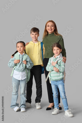 Mature teacher with little ...