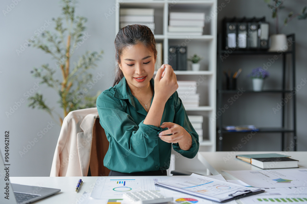 Asian businesswoman who is tired and sleepy from sitting at a desk for a long time. Works in financial documents, accounting, statistics and has office syndrome. Asian businesswoman who is tired and sleepy from sitting at a desk for a long time. Works in financial documents, accounting, statistics and has office syndrome.