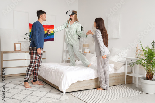 Young man with two women us...