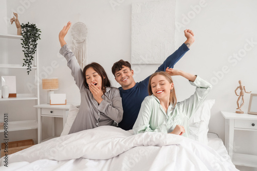Sleepy young man with two w...