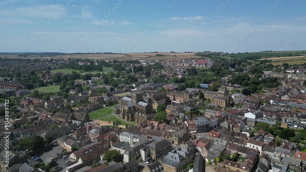 Sherborne, Dorset, England: DRONE VIEWS: The drone circles the centre of Sherborne and Sherborne Abbey. Sherborne is an affluent market town and popular UK tourist destination (Clip 1). Sherborne, Dorset, England: DRONE VIEWS: The drone circles the centre of Sherborne and Sherborne Abbey. Sherborne is an affluent market town and popular UK tourist destination (Clip 1).