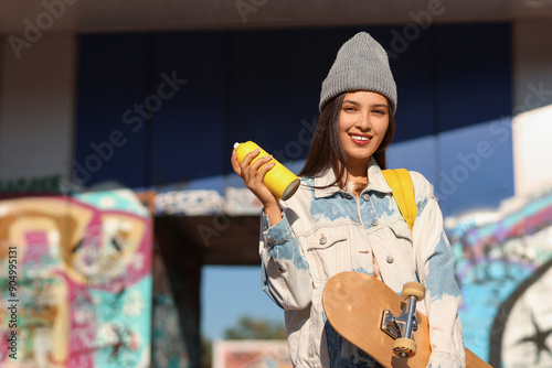 Young Asian woman with spra...