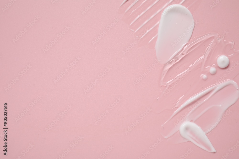 Face cream and gel on pink background, top view. Space for text Face cream and gel on pink background, top view. Space for text